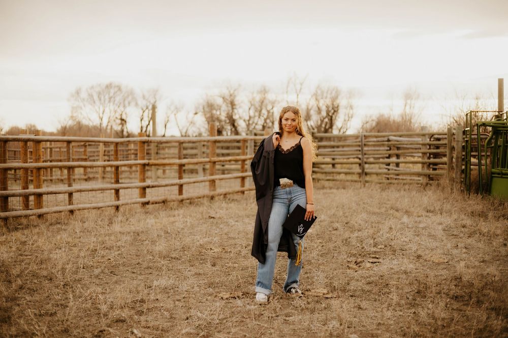 Western Lifestyle photoshoot along rustic wooden fencing in a desert ranch setting.