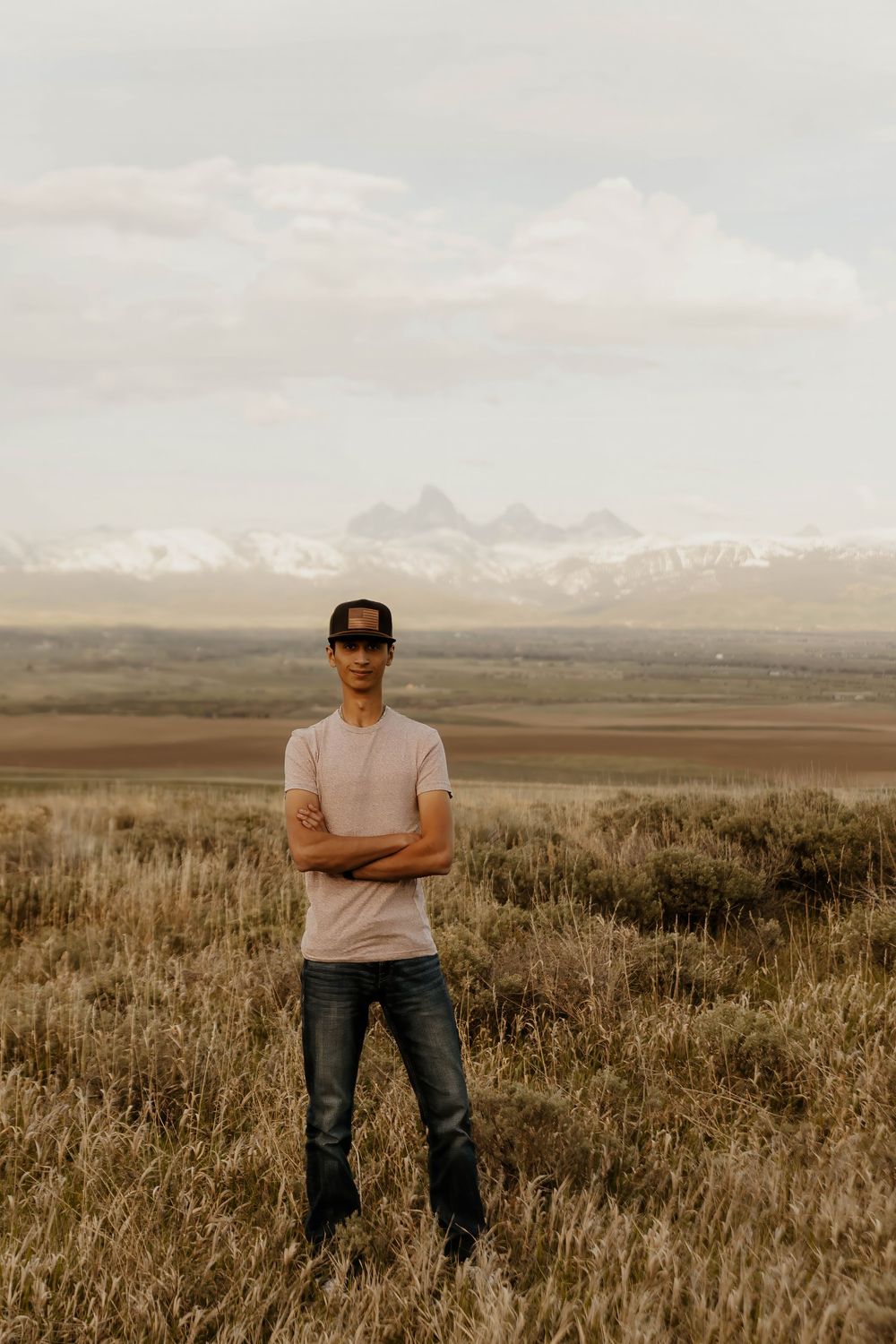 Western landscape photoshoot with mountains and sagebrush in background.