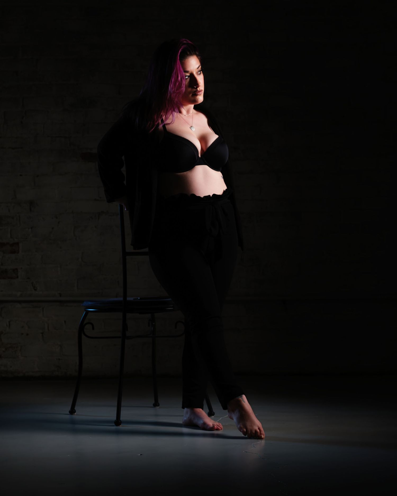 Moody woman boudoir with tattoos