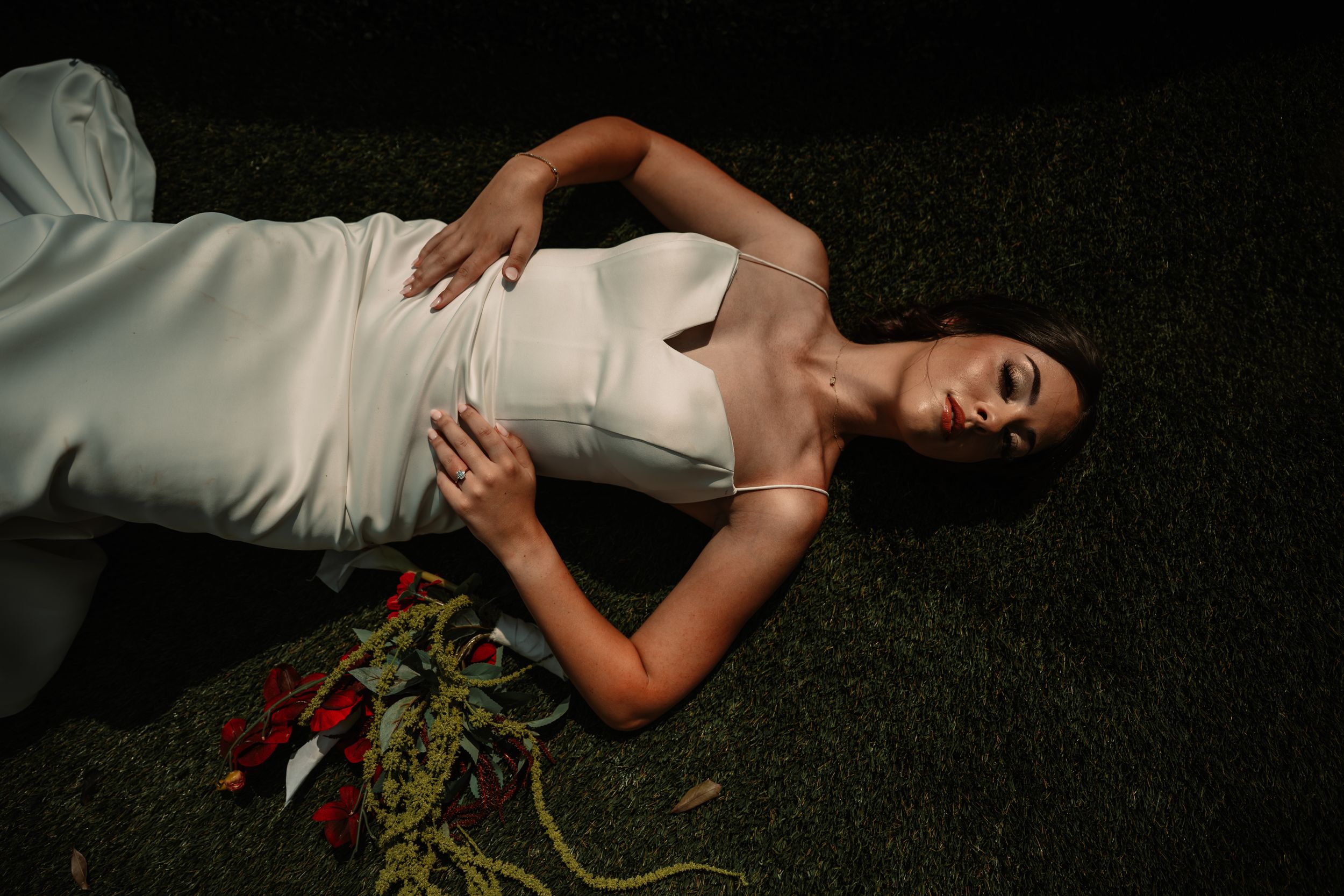 Bridal portrait session in Dallas–Fort Worth featuring woman smiling in soft natural light with a dark and moody vibe