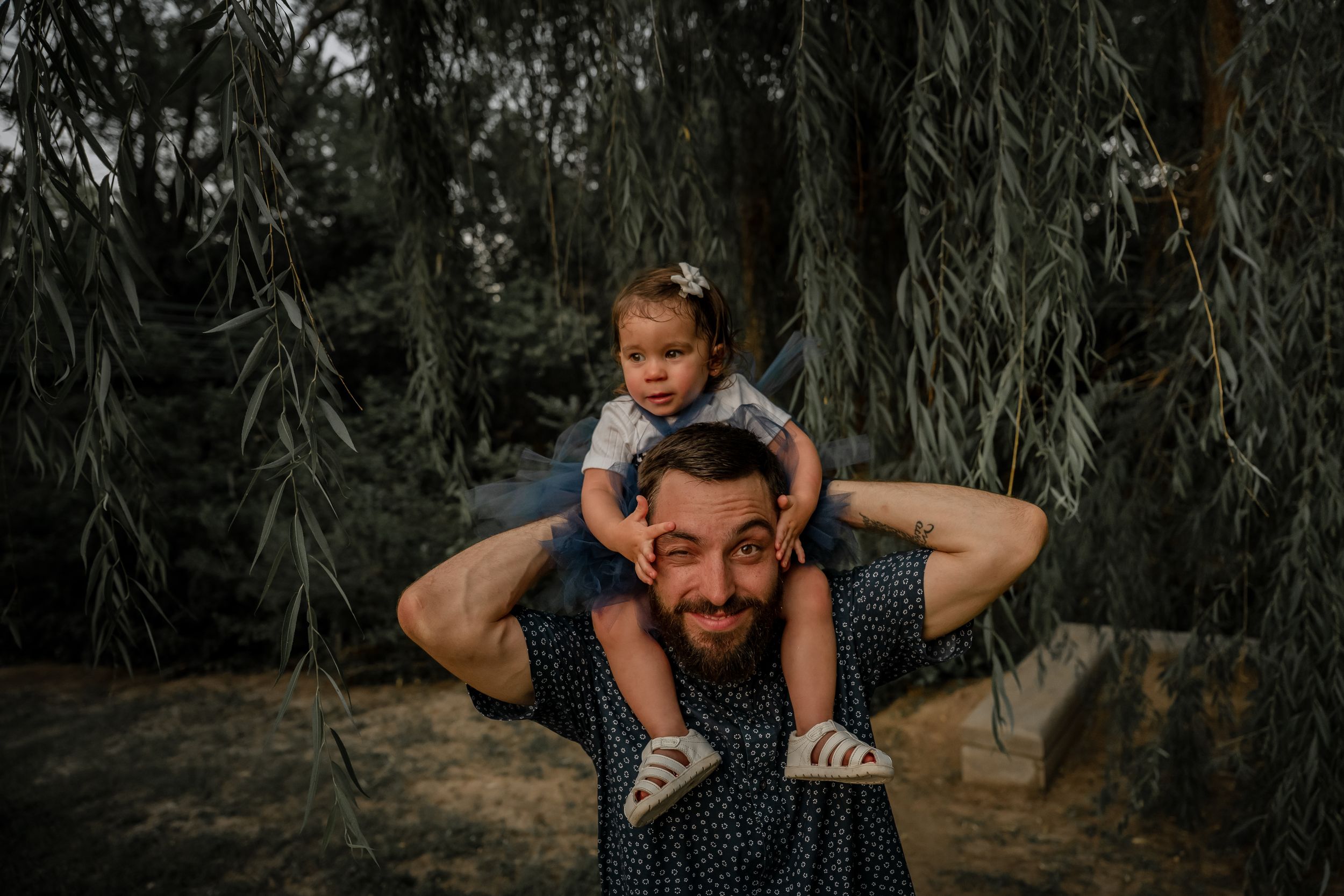 Dallas–Fort Worth family photographer capturing candid moments in an outdoor session