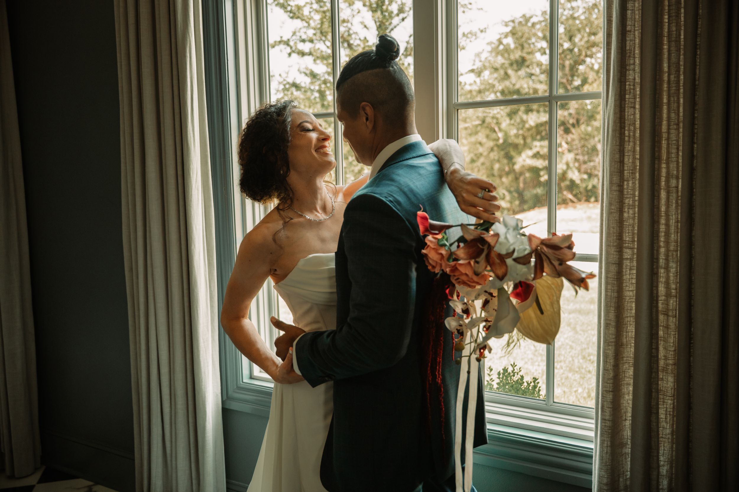 DFW wedding portraits at the Hillside Estate in Cross Roads, TX near Denton and Aubrey Texas. Couple romantically captured  near window