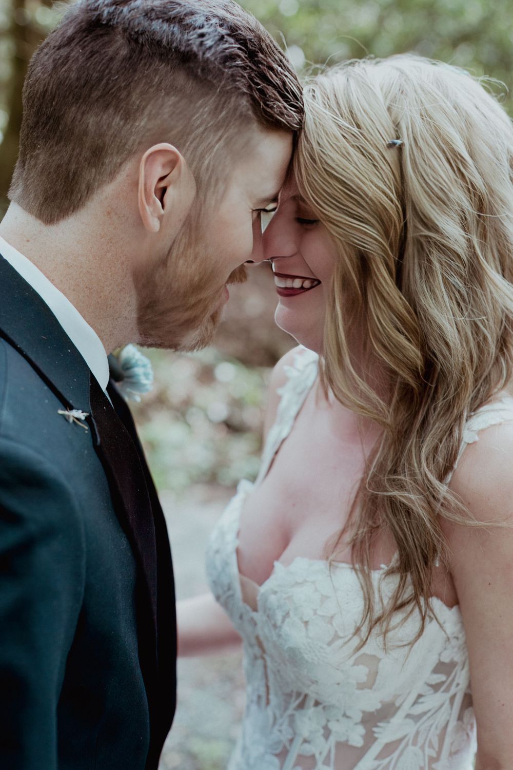 An intimate moment between newlyweds sharing a close embrace.
