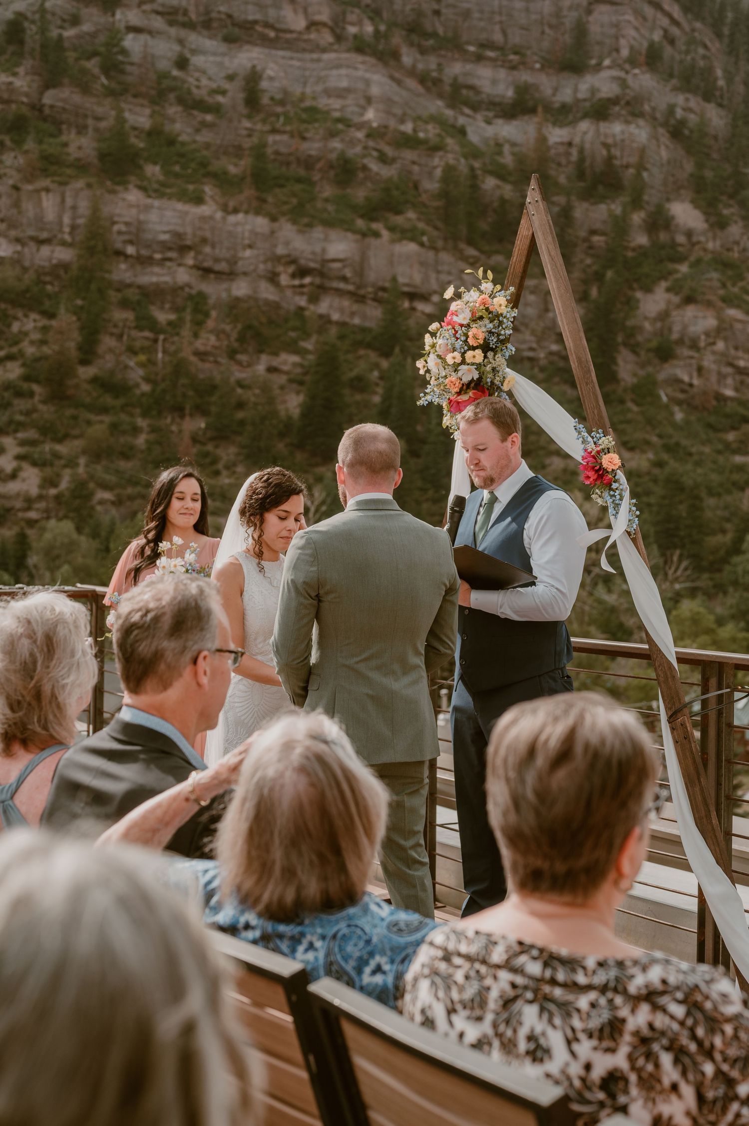 A vintage light blue convertible car parked on a misty mountain road with elopement newlyweds photo by Samantha Campbell imagery