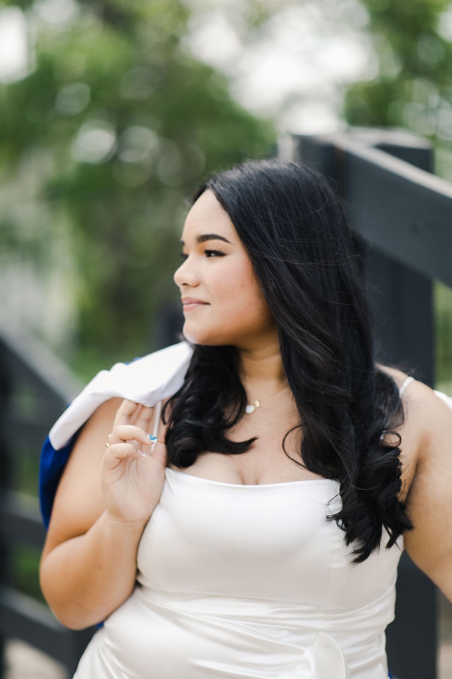 A series of five connected photos showing a woman in a white sleeveless dress posing outdoors with natural lighting.