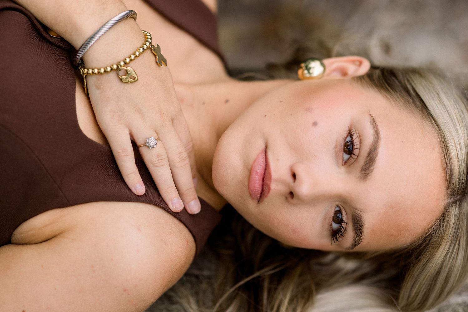 A collage of intimate senior photography portraits showing soft lighting and delicate poses against neutral backgrounds.