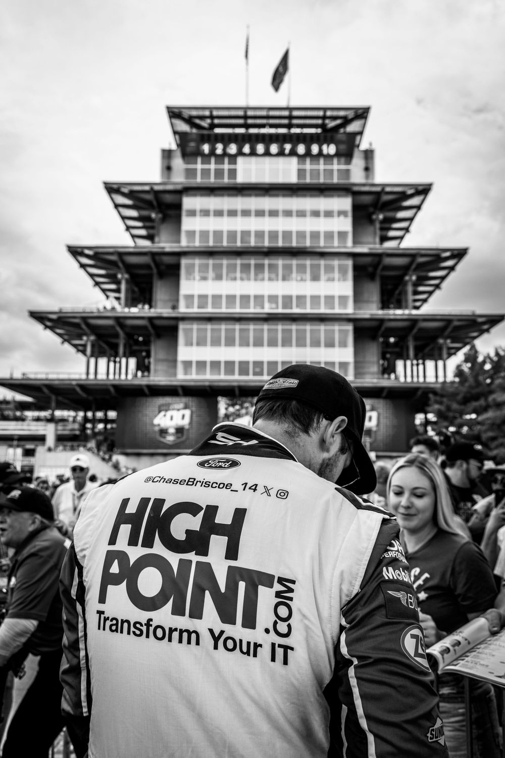 Indianapolis Motor Speedway pagoda tower stands against cloudy sky.