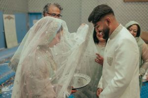 A joyful moment between a couple during their wedding ceremony.