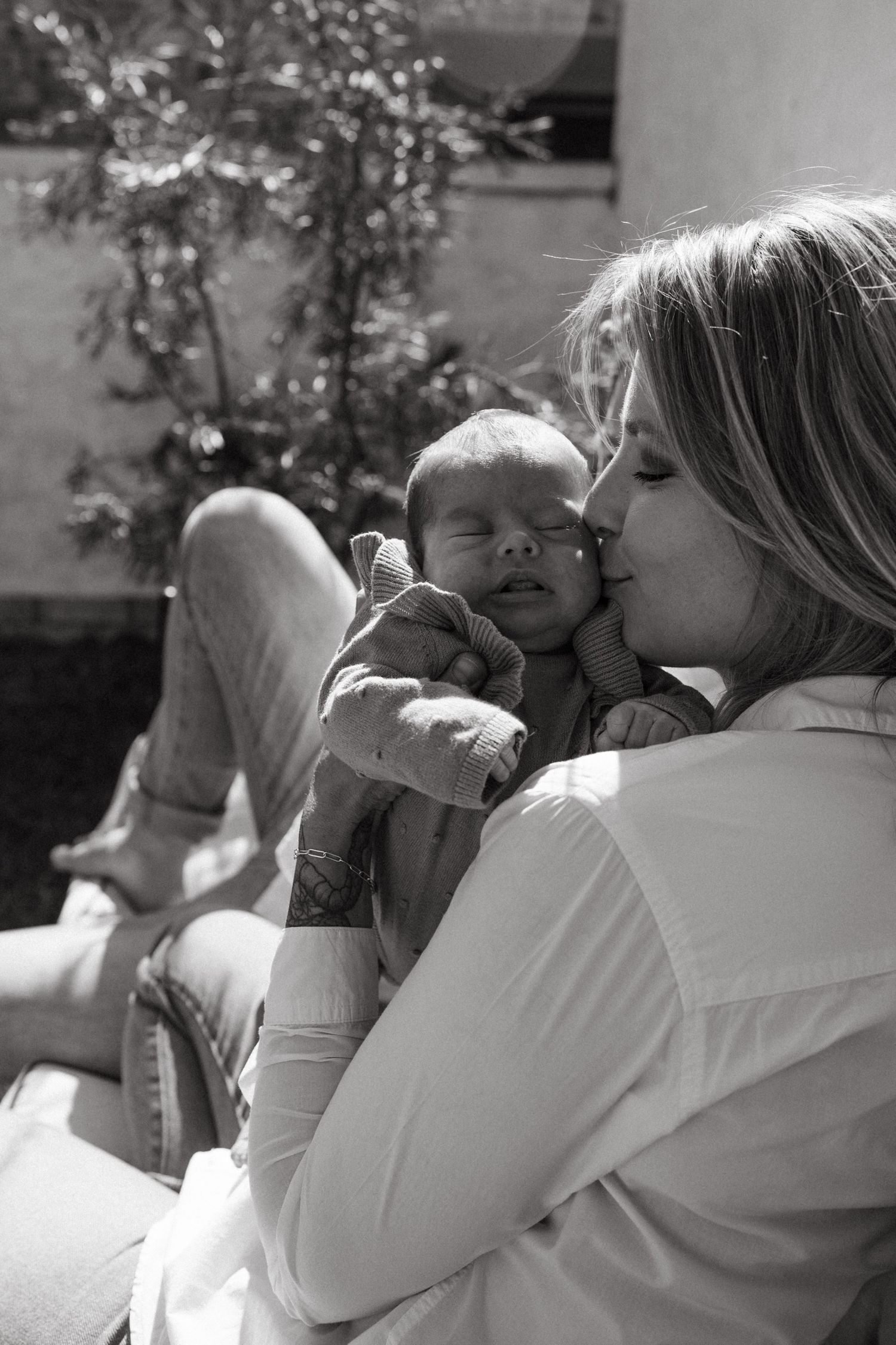 Black and white intimate portrait sequence showing tender moments in natural light.
