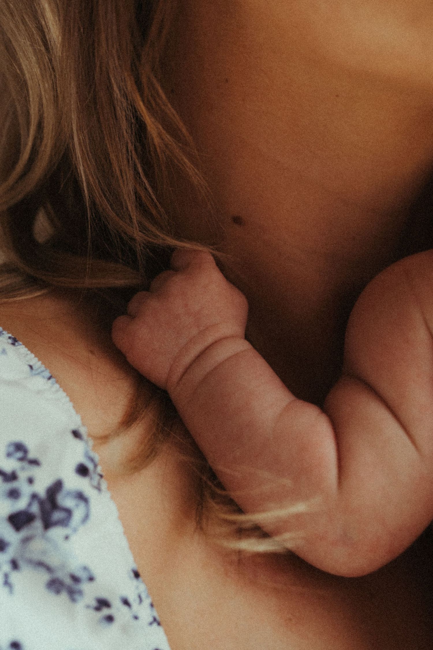 Close-up details of floral fabric and intimate moments in soft lighting.