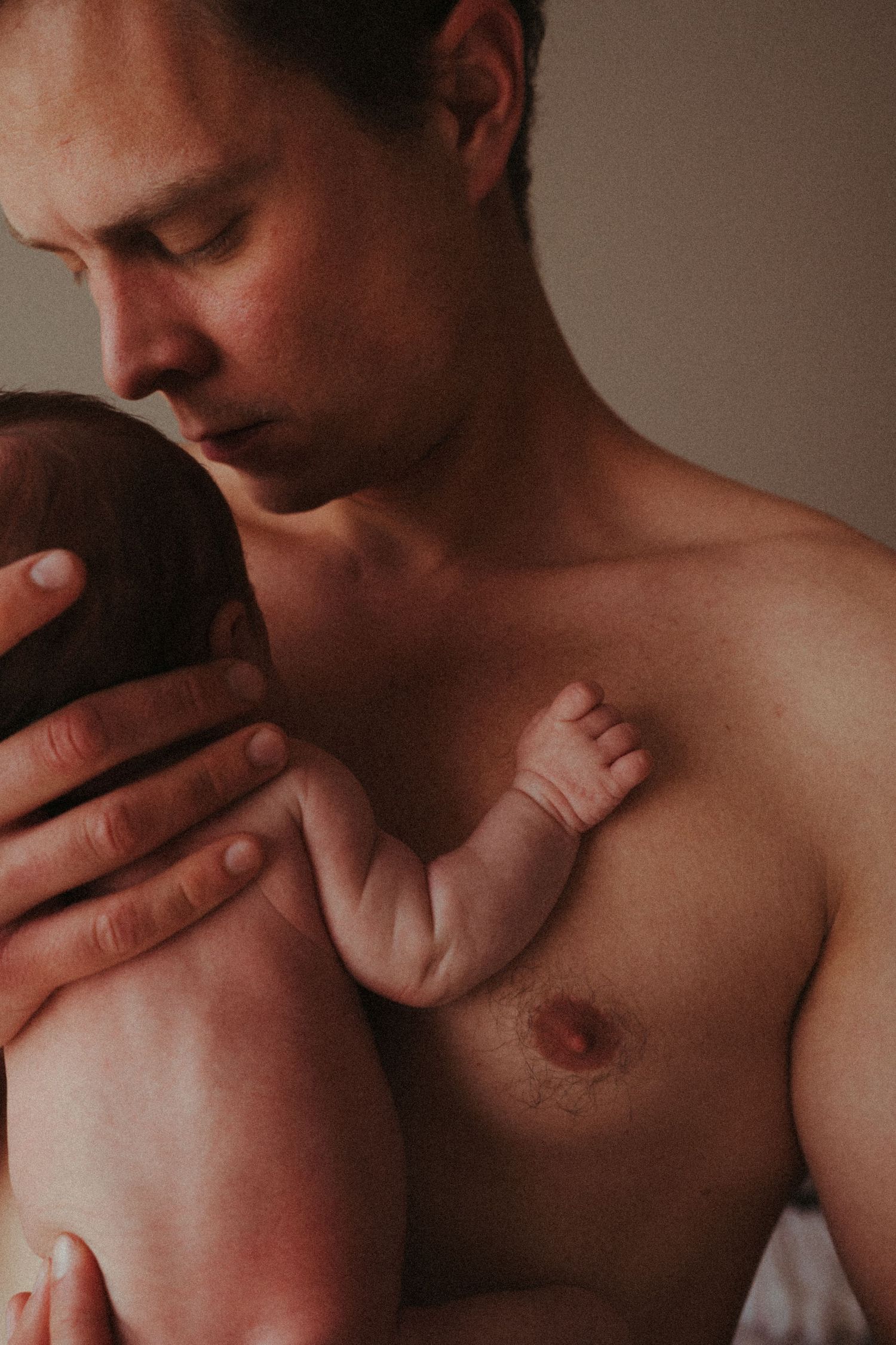 Warm-toned close-up series showing tender moments between parent and infant.