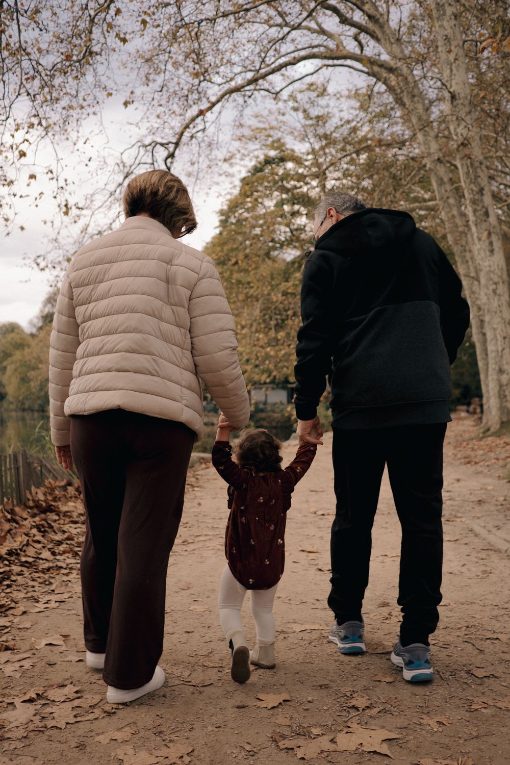 family at parc tete dor, walking with a baby