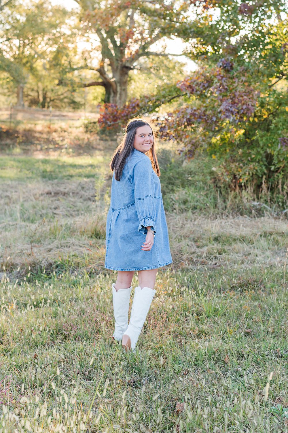 Senior girl posing walking in field, Sharpsburg, GA