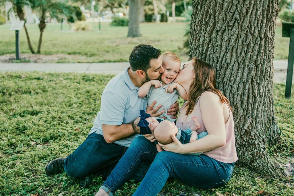 Candid family moment with toddler and newborn twins in Venice, FL
