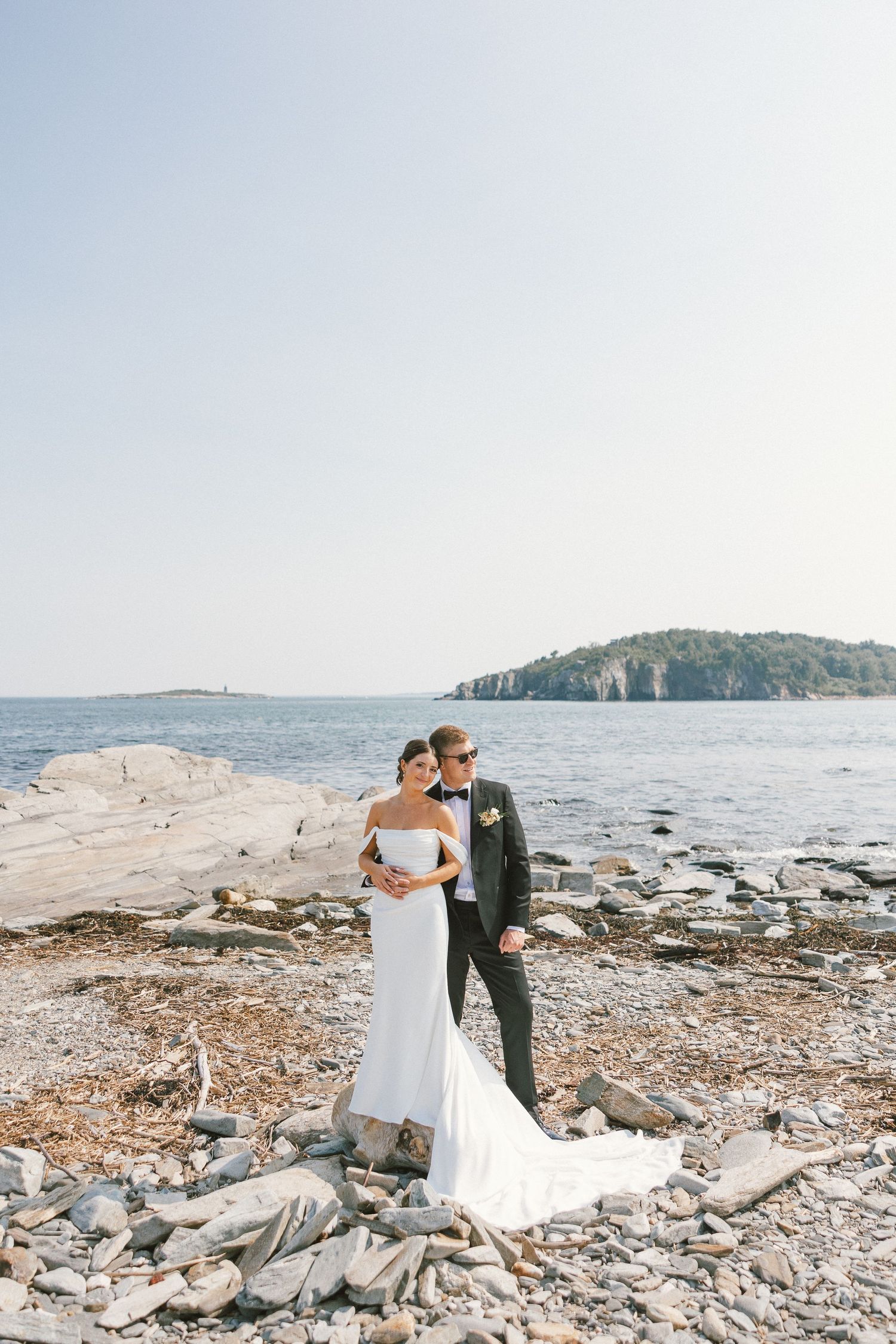 Scenic coastal wedding ceremony location with rocky shoreline and ocean views.