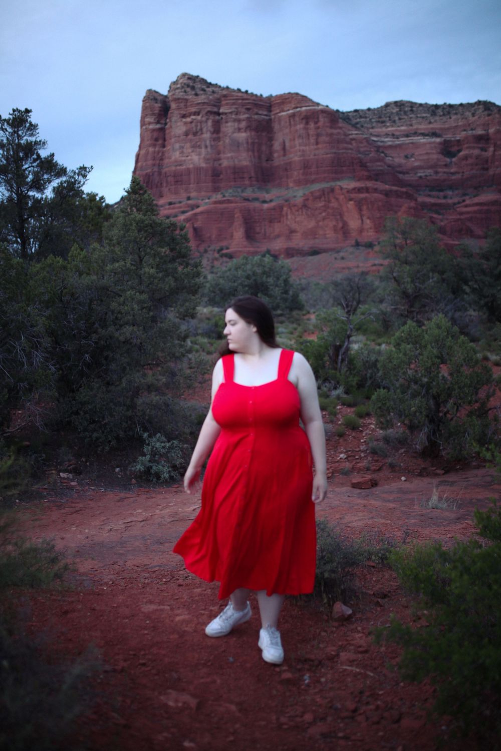 Girl in red dress in Sedona at blue hour