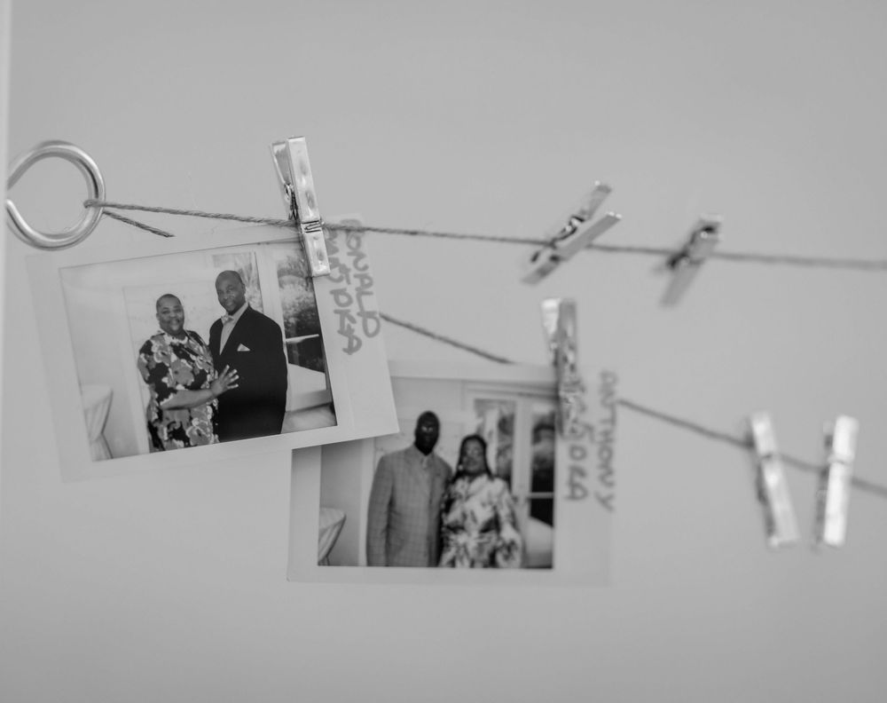 Artistic black and white detail shot of wedding decorations hanging from above.