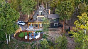 Aerial/drone photo of the Midnight Ridge, a vacation rental property in Evergreen, CO.