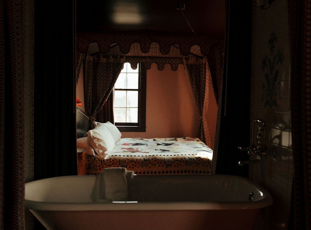 Interior view of a cozy room with vintage decor and natural window lighting.