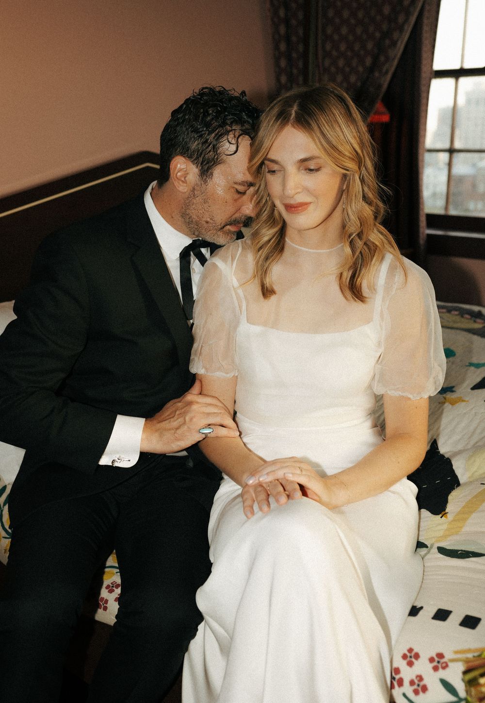 Intimate wedding preparation moments captured in soft natural light.