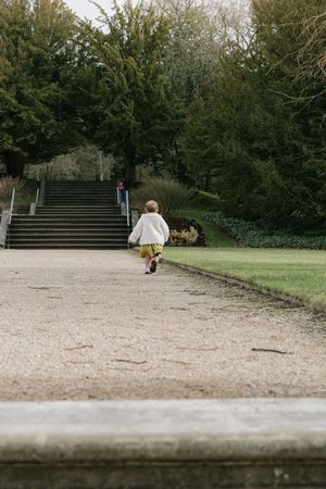 A series of park steps and pathways through green trees and grass shown from different angles and distances.