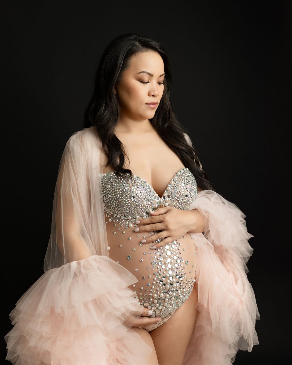 An Asian newborn mom wearing a bodysuit and a peach robe. Greenville SC newborn photographer. - Easley Sc newborn photographer. Greenville