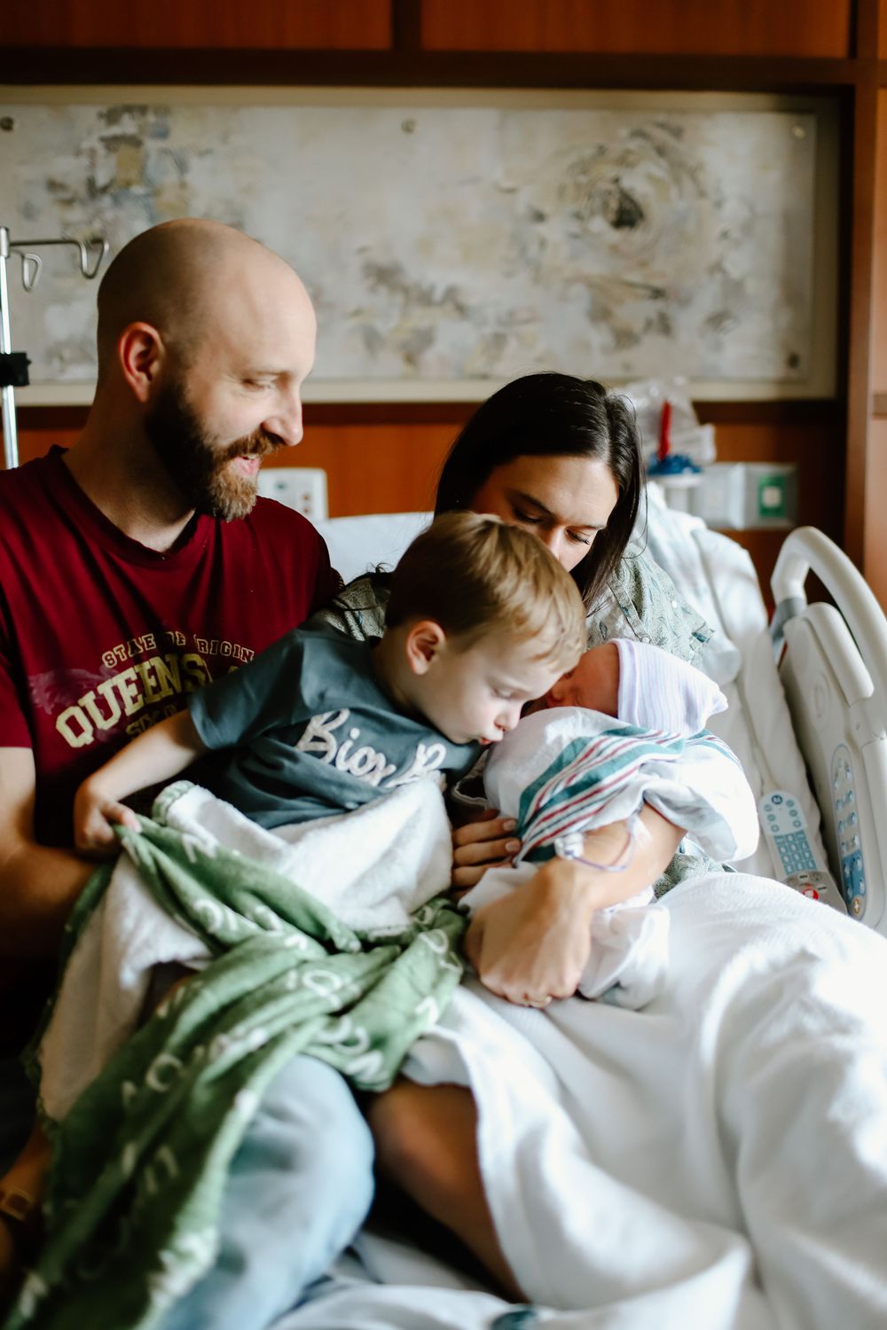 Indoor family moment captured in natural documentary style with soft lighting.