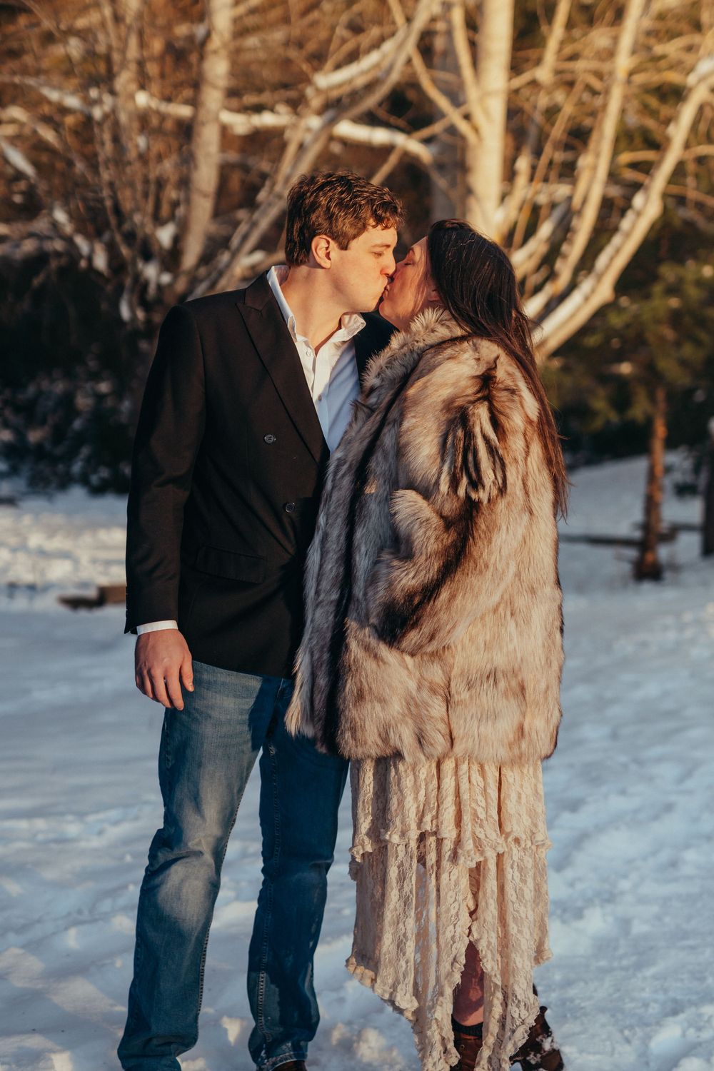 sunset winter elopement fur jacket