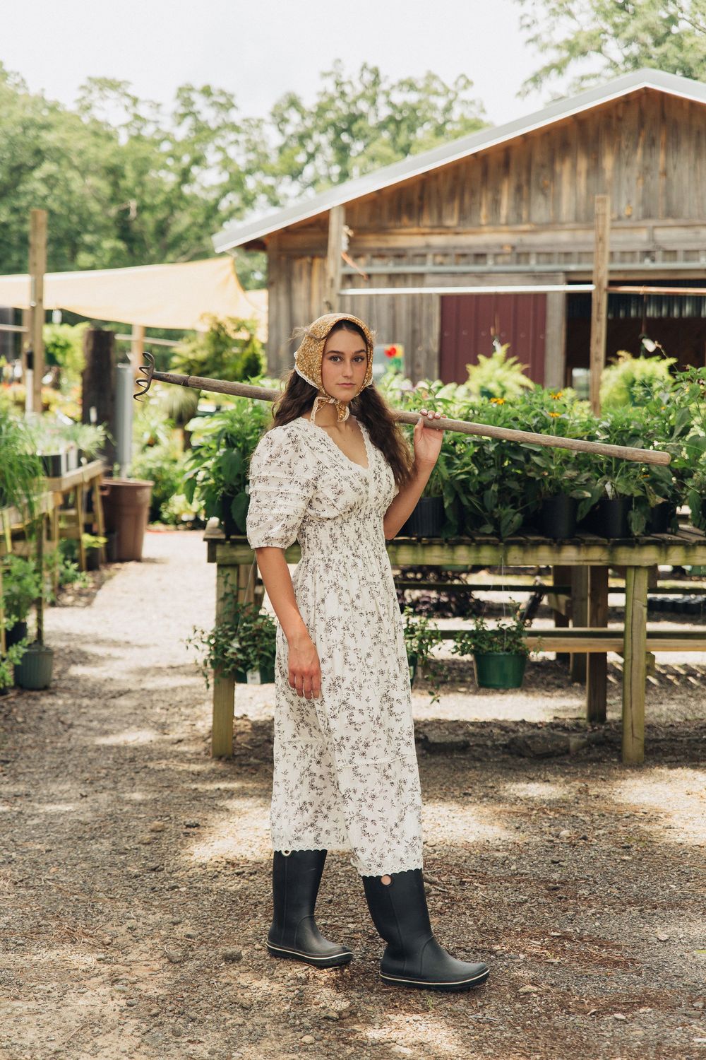 Rustic farm editorial with model wearing headscarf and rain boots, Atlanta editorial portrait and fashion photographer