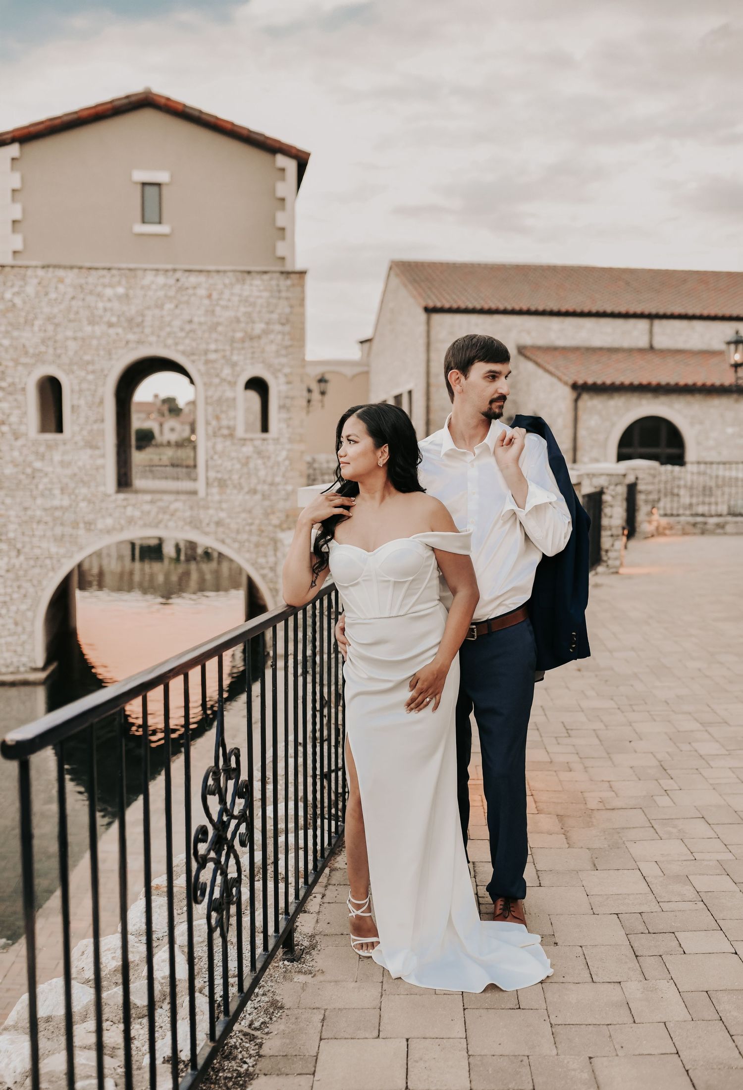 Engaged couple photographed beside the peaceful water at Chapel at Palacios in North Texas
