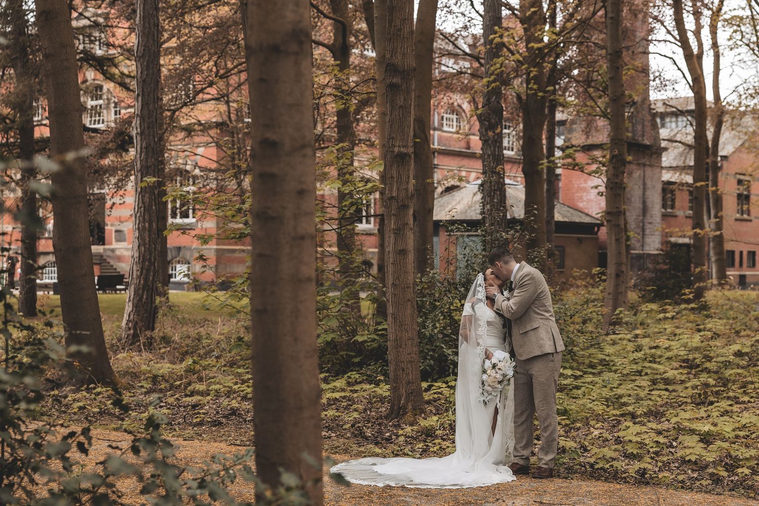 A guided relaxed couple portrait in front of The Pumping House