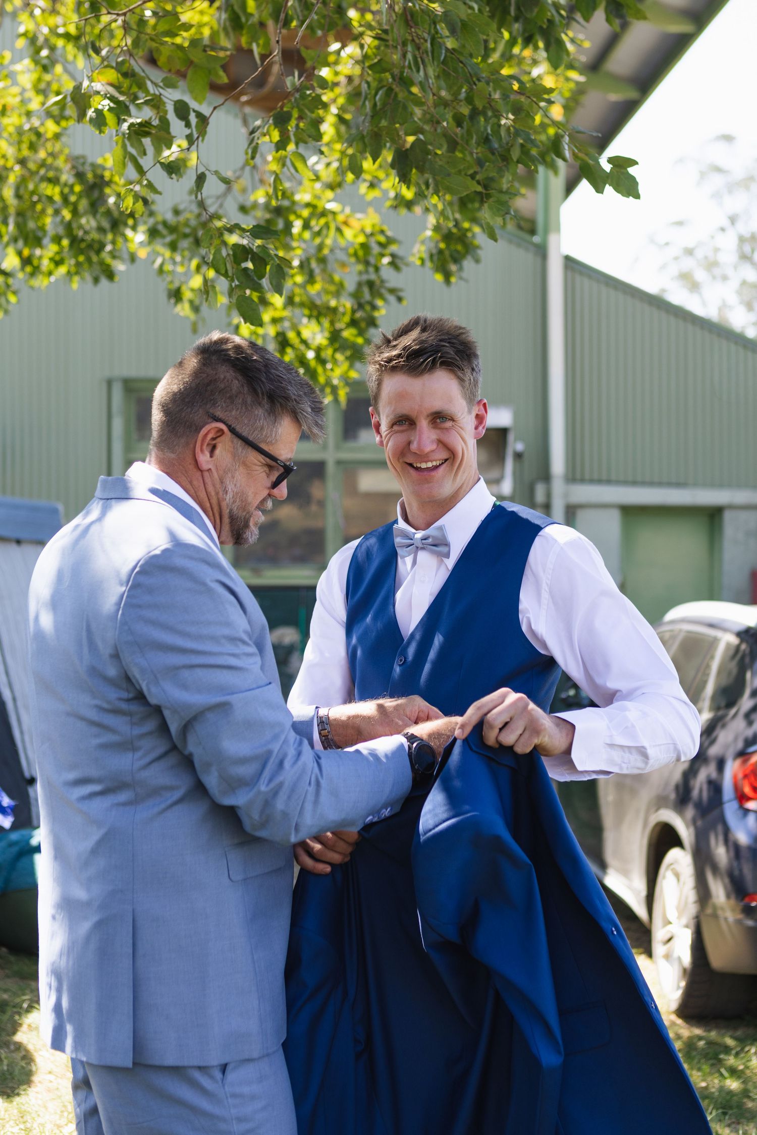 Father of the groom helping groom get ready at Jess and Lachie's Dungog Wedding at Hunter Valley NSW