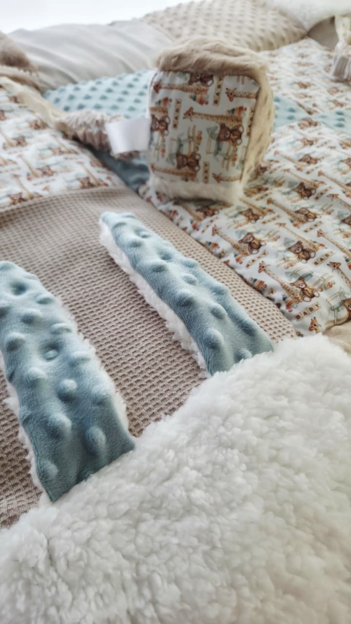 Soft baby blanket set featuring minky dot fabric in blue and tan with woodland animal print patches.