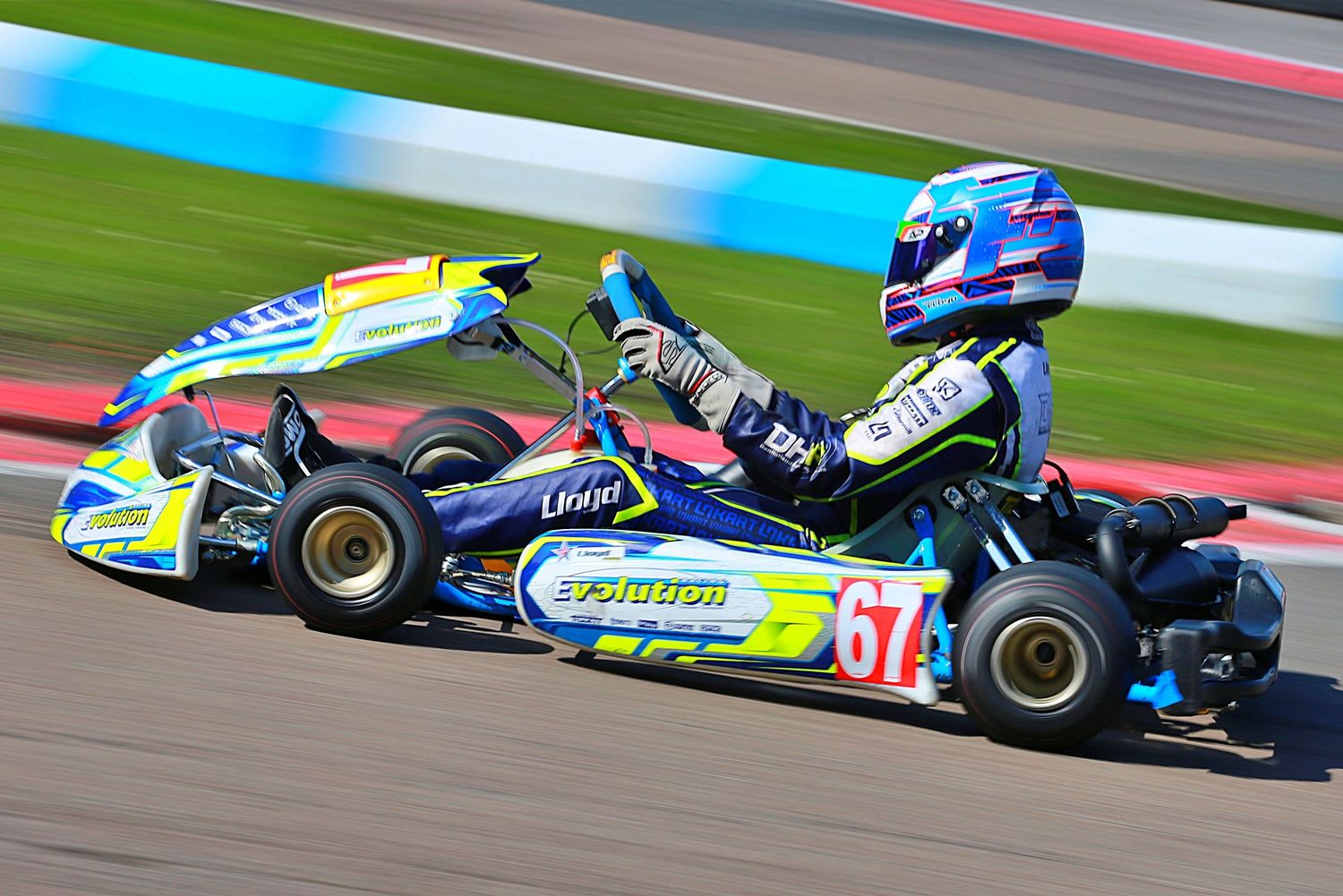 Blue and yellow go-kart number 67.