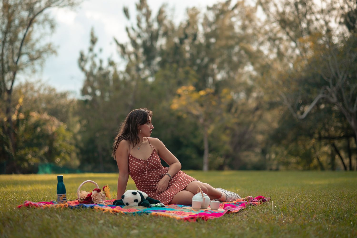 Outdoor maternity portrait in a sunlit South Florida field