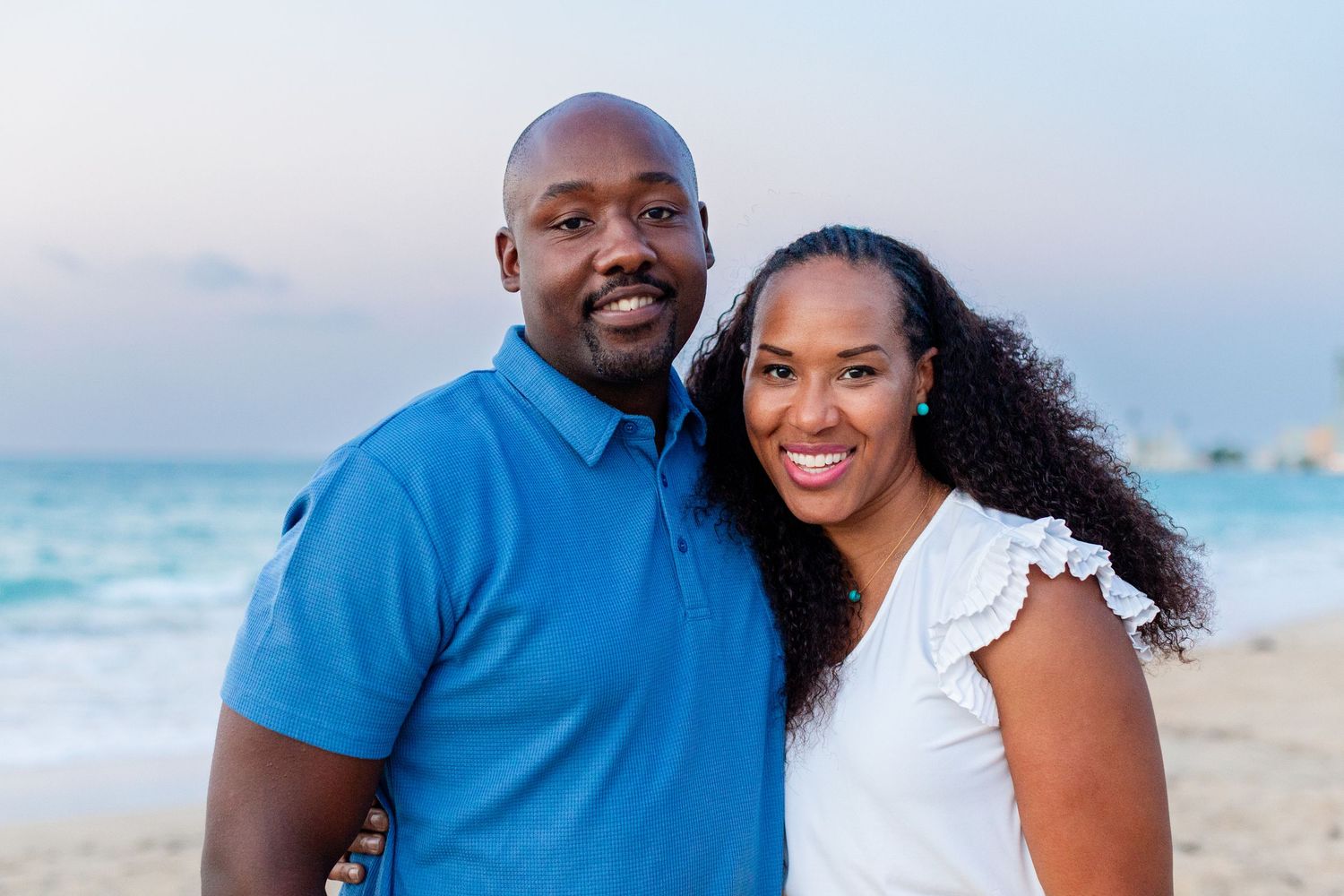 Couples portrait on the beach in Isla Verde, Carolina, Puerto Rico.