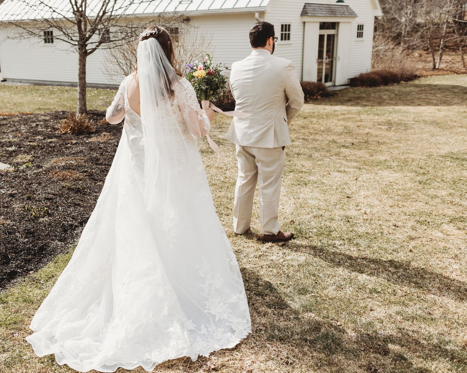first looking happening at 1812 farm in bristol maine by maine wedding photographer in early march for winter wedding
