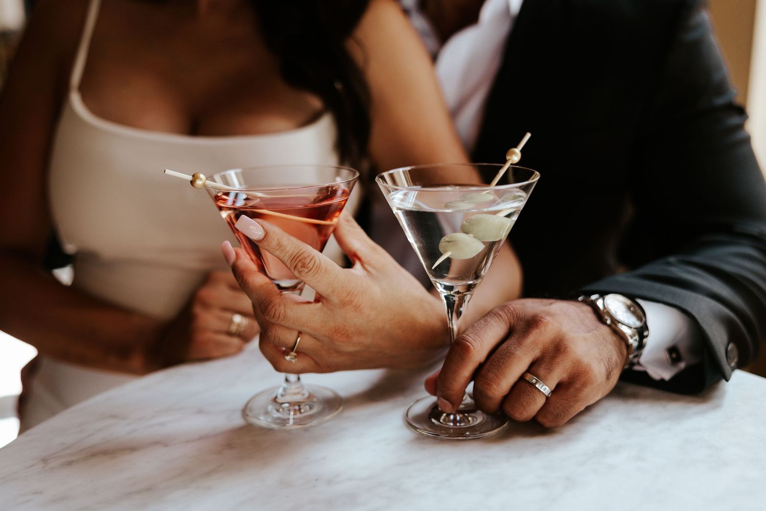couple holding martini glasses celebrating their san francisco elopement day