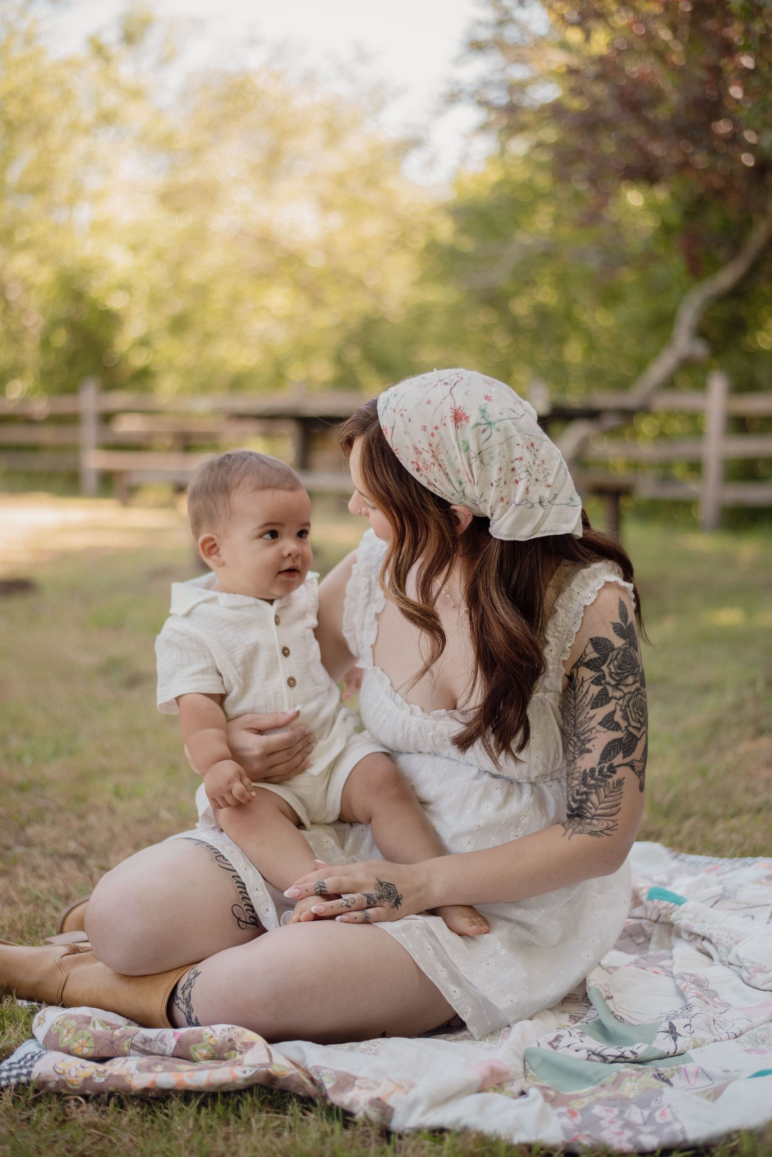 A mother and child wrapped up in each other, capturing the tenderness, laughter, and little moments that make motherhood so fleeting.