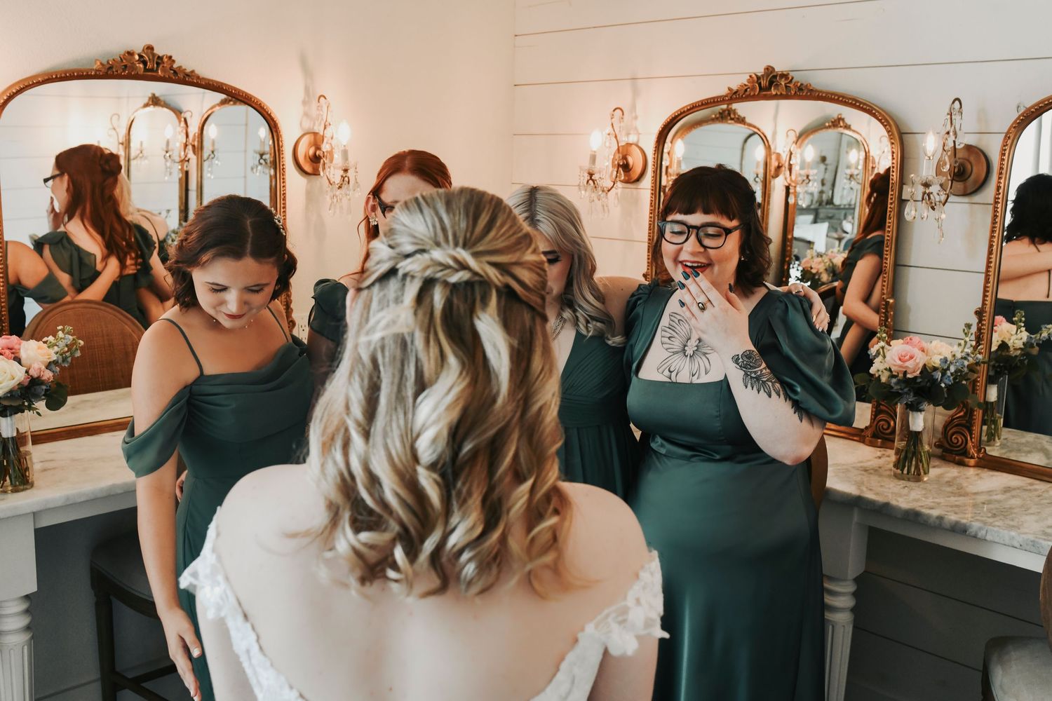 Kathryn and her bridal party wearing matching pajamas in The French Farmhouse bridal suite