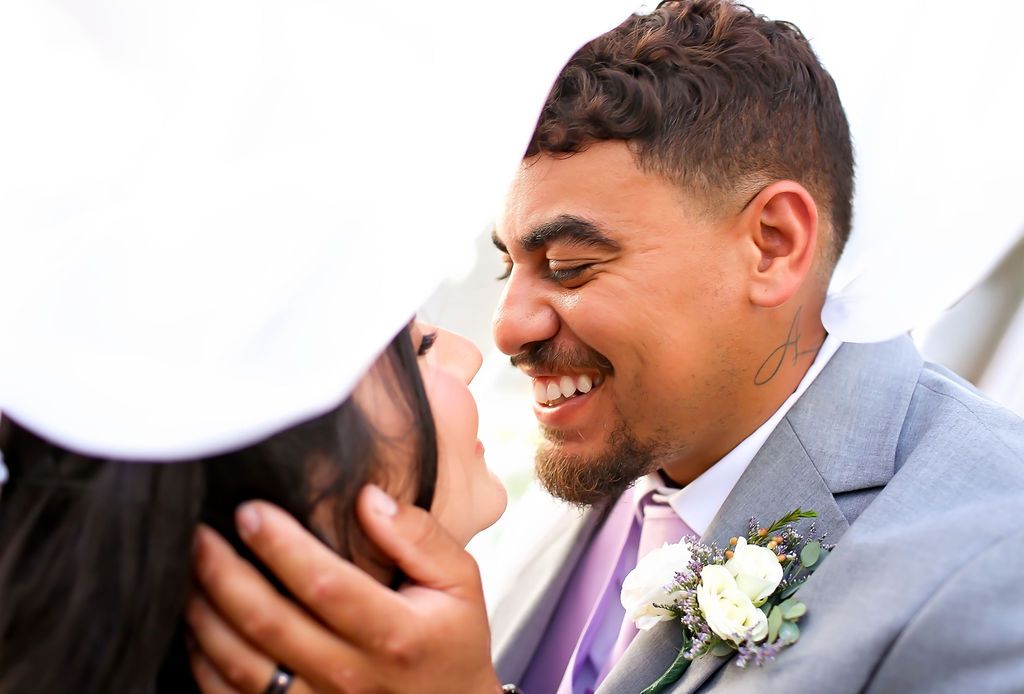 Groom looking at his beautiful bride on their wedding day