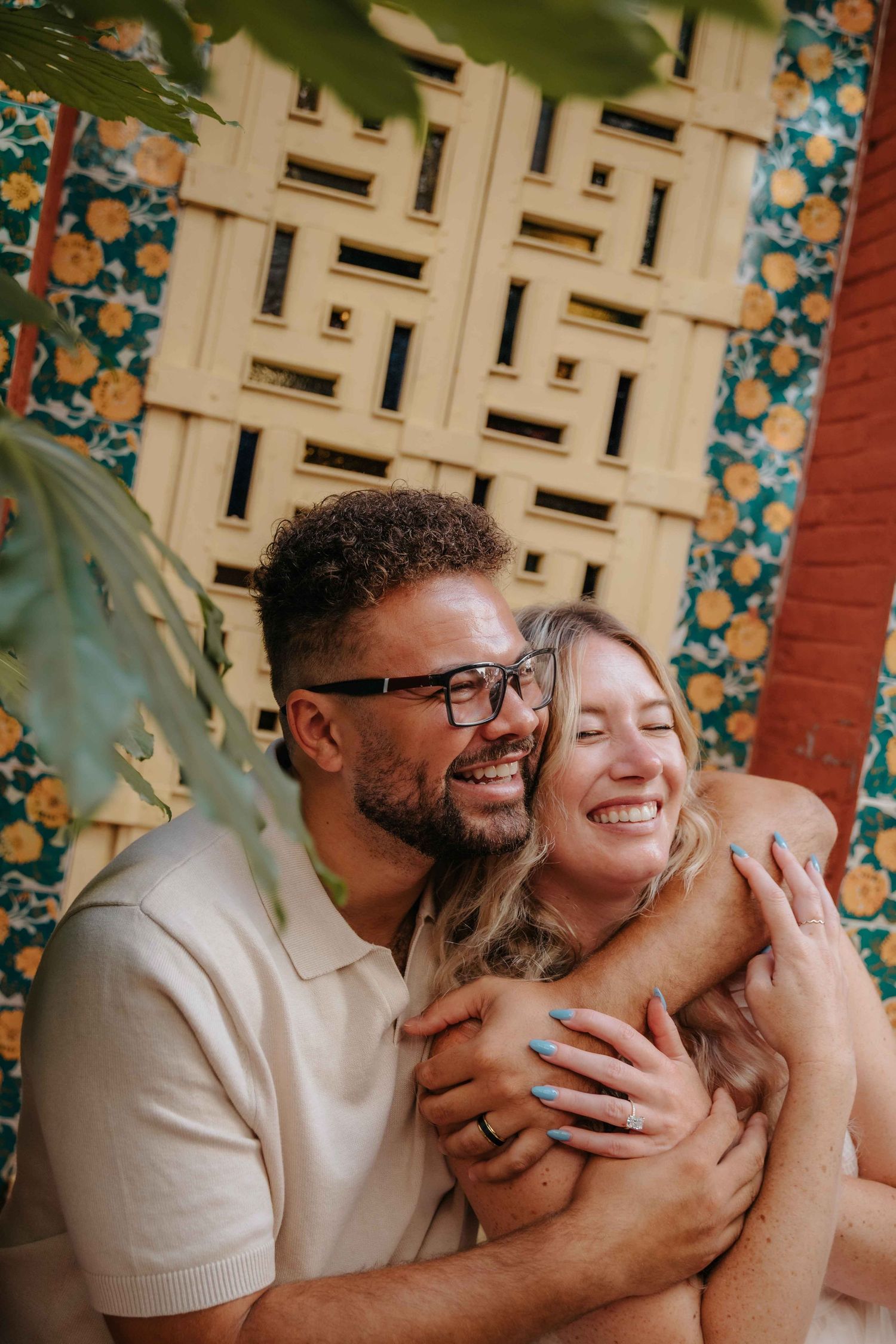 Engaged couple posing naturally for a beautiful engagement photoshoot at an iconic location in Barcelona.