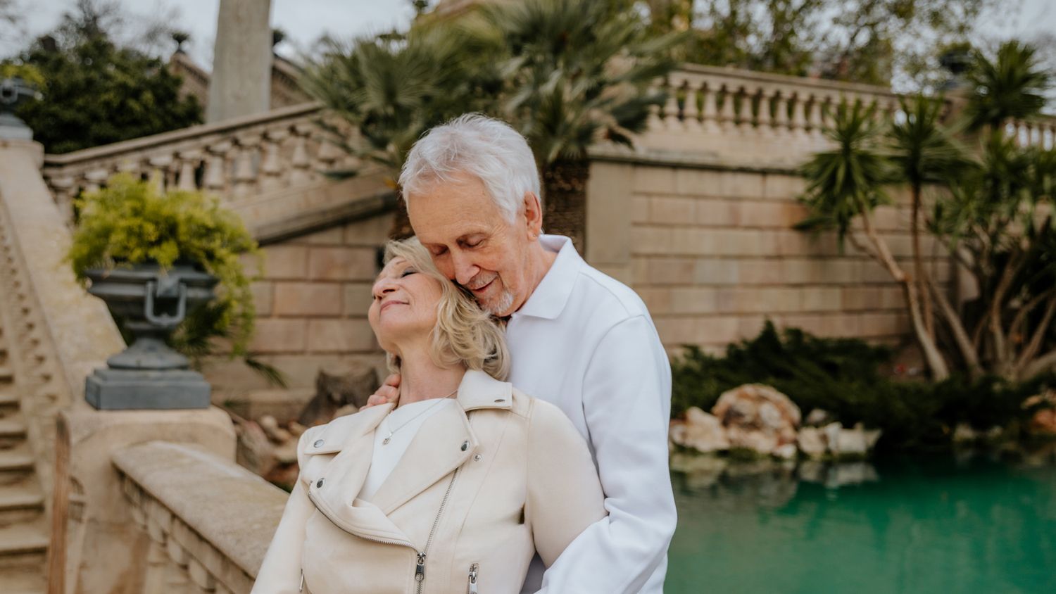 A romantic anniversary portrait of a couple taking a peaceful rowboat ride on the serene lake inside Ciutadella park