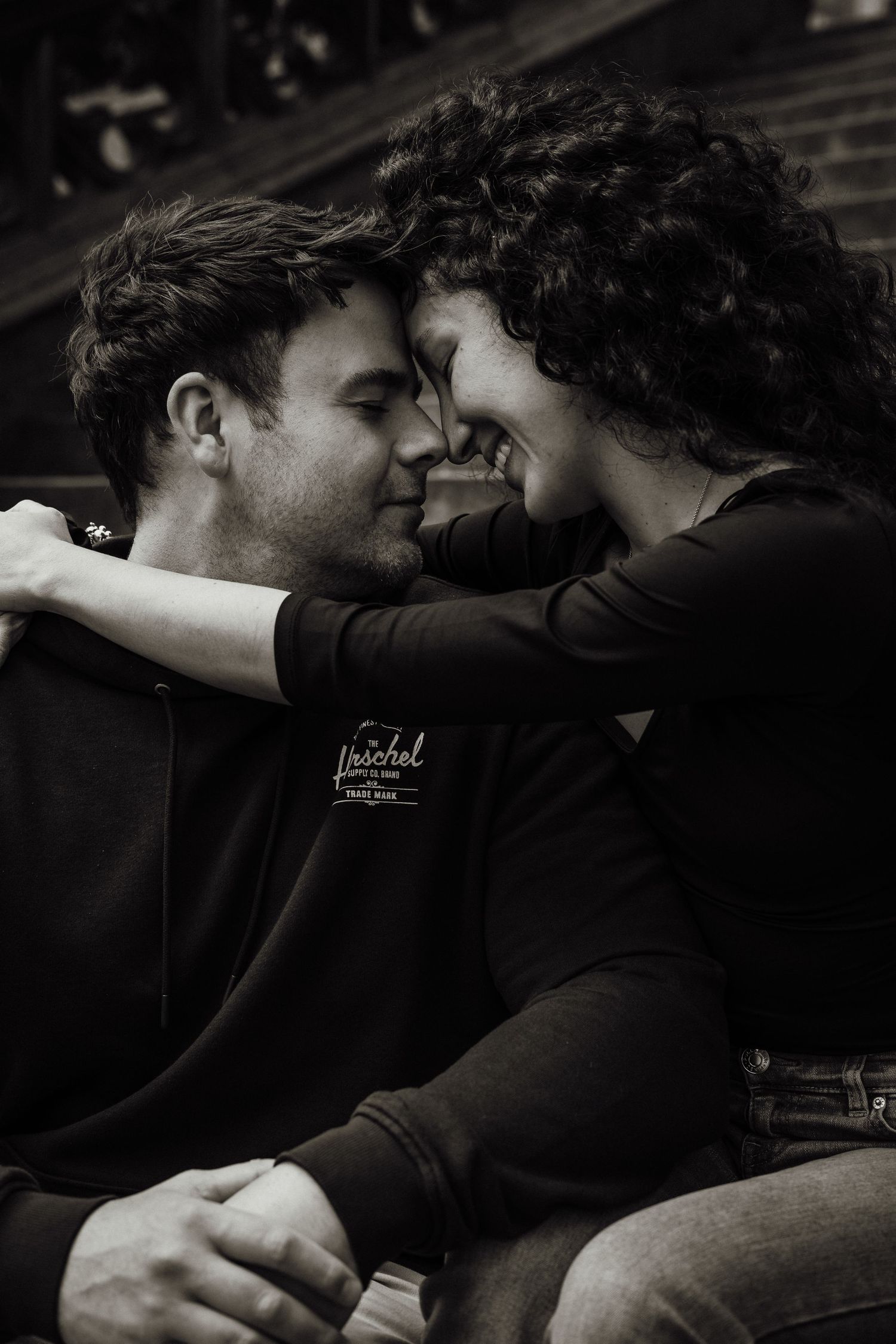 moody black and white portrait of a romantic moment shared by a couple in Edinburgh captured by Scottish couples photographer
