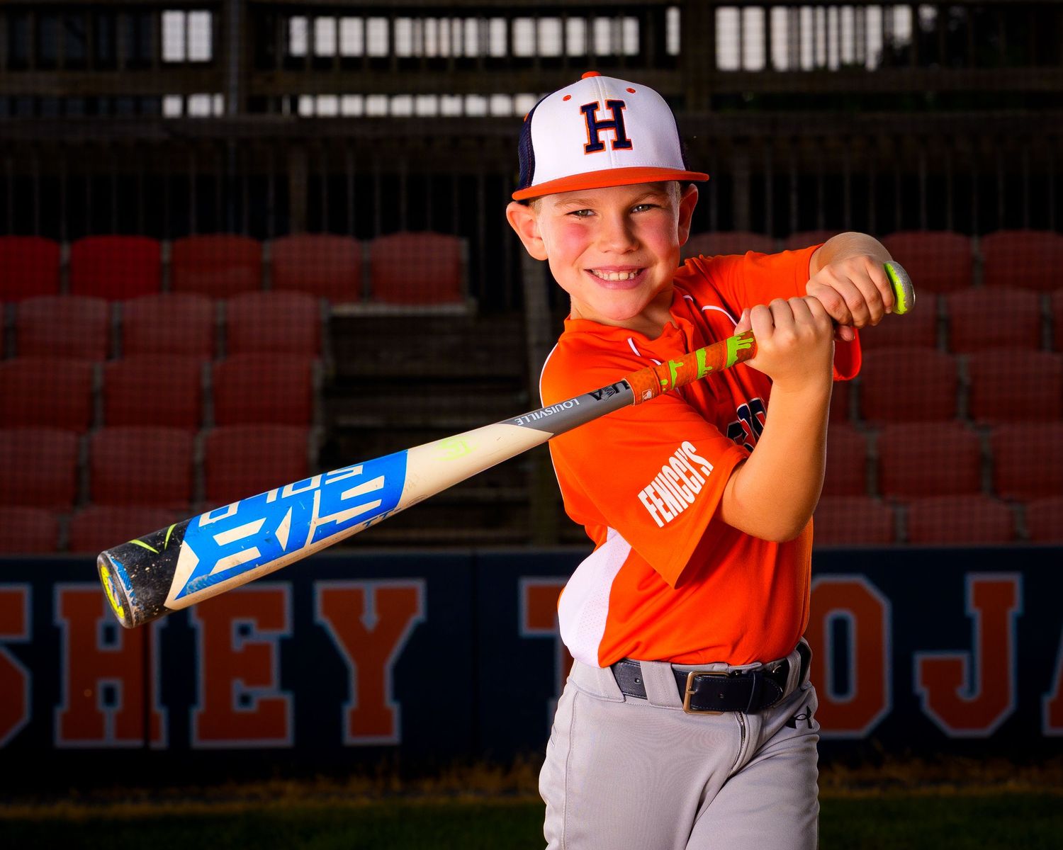 Hershey Little League player posing with bat for Media Day portrait, by Deanna Fox, SportsFox Photography, Hershey PA