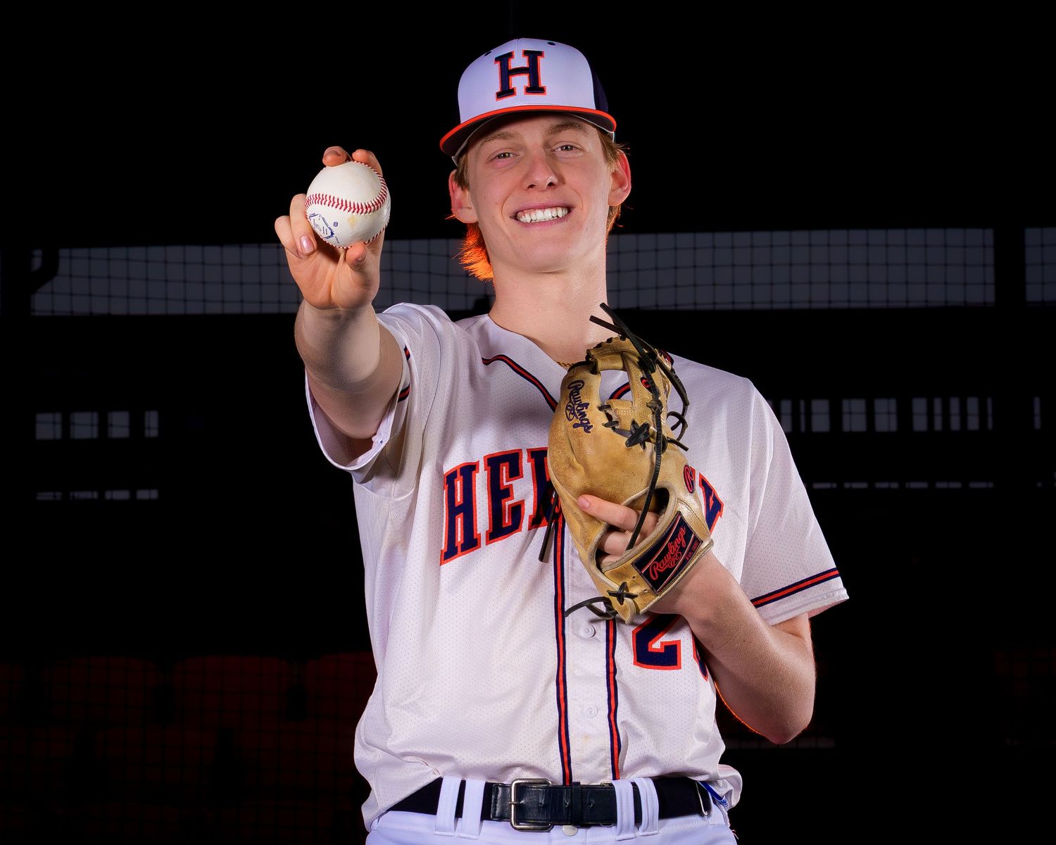 Hershey High School baseball player holding ball for Media Day portrait, by Deanna Fox, SportsFox Photography, Hershey PA