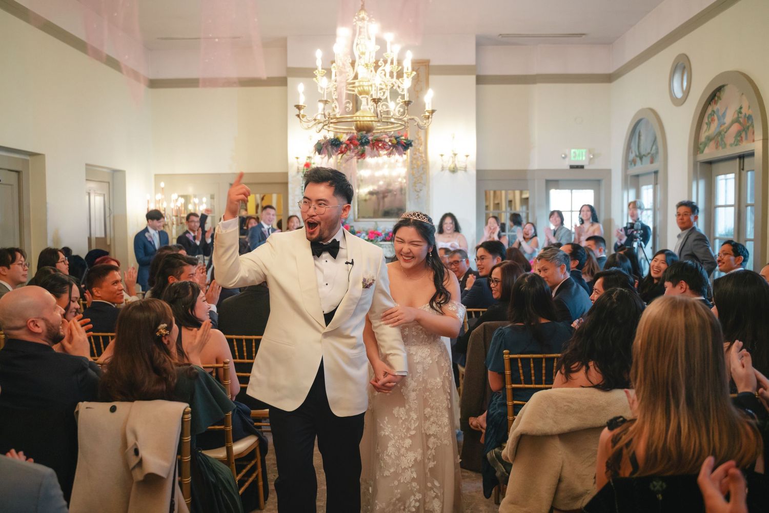 A romantic wedding moment captured between a couple during an outdoor ceremony.