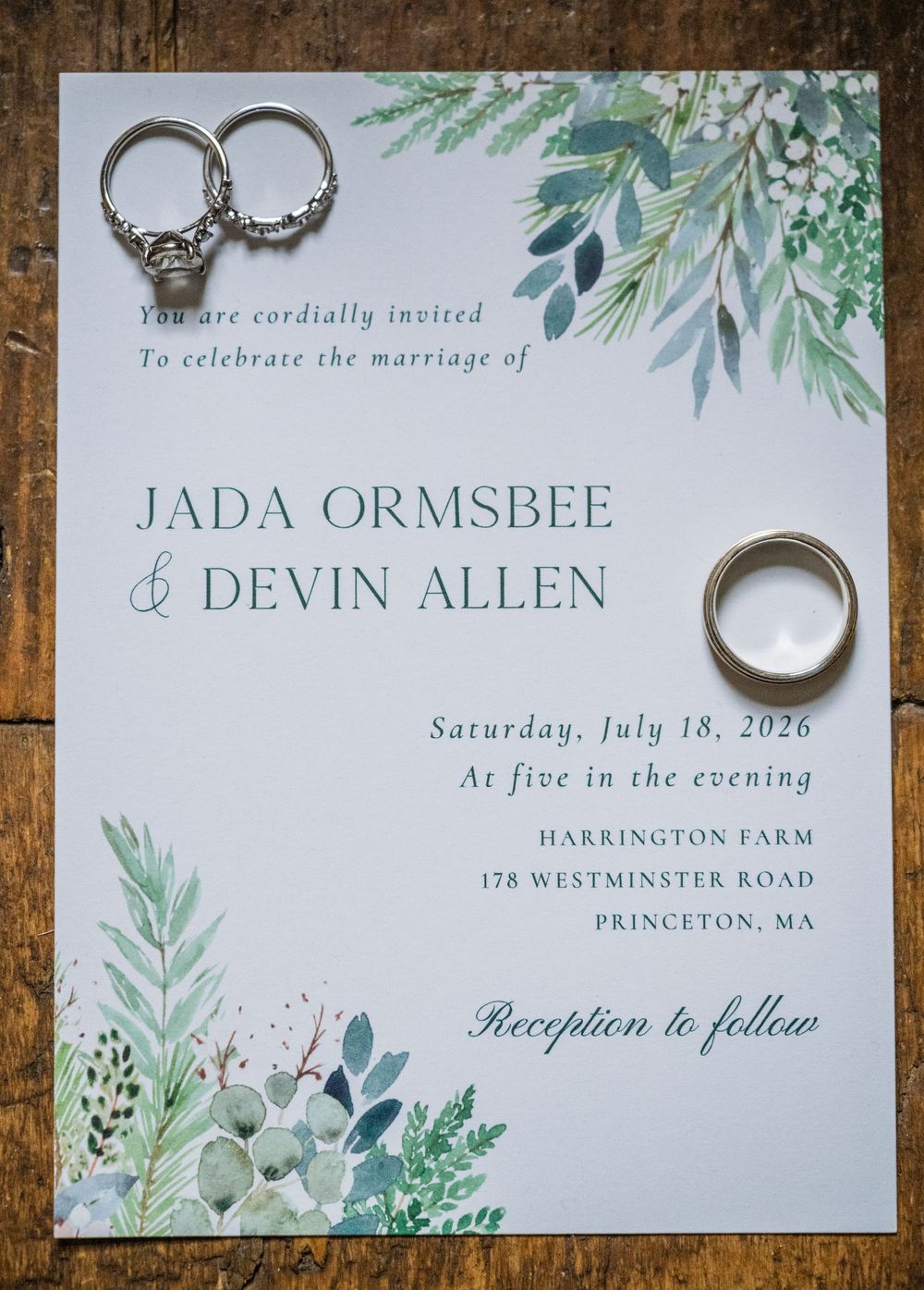 Wedding invitation for Jada Ormsbee and Devin Allen at Harrington Farm, Princeton MA, with rings on top.
