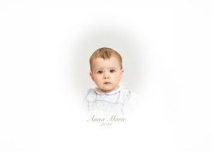 Portrait of a baby named Anna Marie in a white outfit against a soft white background, captured in a timeless studio photo.