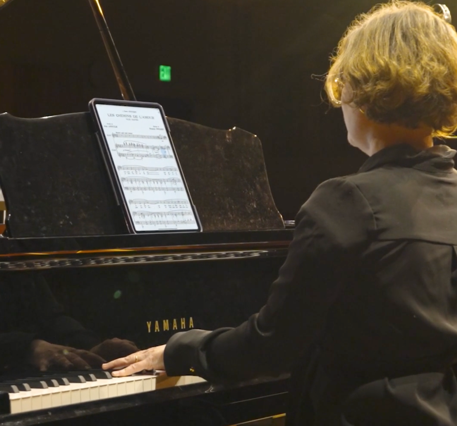 Photo of a piano player performing for a film production produced by Chris Brecht